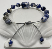 Load image into Gallery viewer, Leather Sliding Knot Bracelet Blue White Stone with Silver African Map Symbol
